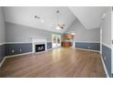 Spacious living room with vaulted ceiling, fireplace, and wood-look floors at 30 Village Dr, Cartersville, GA 30121