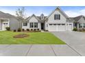 Charming home featuring a well-manicured lawn and inviting curb appeal with an attached two car garage at 408 Cottonwood Cir, Peachtree City, GA 30269