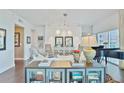 Bright living room showcasing modern furnishings, hardwood flooring, and piano at 1820 Peachtree Nw St # 1008, Atlanta, GA 30309