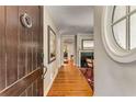 Elegant foyer with hardwood floors, a round window, and view of the living room at 2287 Armand Ne Rd, Atlanta, GA 30324