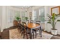 Elegant dining room with natural light, a chandelier, and hardwood floors perfect for entertaining at 1200 Virginia Ct # 101, Atlanta, GA 30306