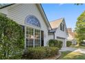 Bright one-story home with an attached garage and meticulously maintained landscaping at 103 St Albans Way, Peachtree City, GA 30269