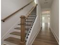 Welcoming entryway featuring hardwood floors, staircase with wood and wrought iron railing at 1518 Gatekeeper Ter, Marietta, GA 30066