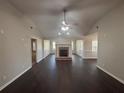 Bright living room boasts dark hardwood floors, fireplace, and ample natural light at 1365 Jubilee Ln, Mcdonough, GA 30253