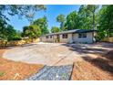 Charming single-story home with large parking pad and lush landscaping at 3154 N Druid Hills Rd, Decatur, GA 30033