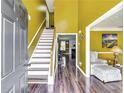 Inviting foyer with hardwood floors and a staircase leading to the upper level at 3710 Burling Rdg, Lithonia, GA 30038