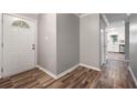 Inviting entryway with hardwood floors leading into the kitchen at 1152 Bailing Dr, Lawrenceville, GA 30043