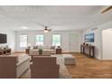Inviting living room with hardwood floors, neutral tones, modern furnishings, and a cozy atmosphere at 5306 Corinth Cir, Stone Mountain, GA 30087