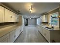 Bright, spacious kitchen featuring modern cabinets, countertops, and an undermount sink at , Covington, GA 30014