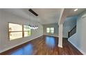 Well-lit dining area featuring modern lighting, hardwood floors, and stairway at 1280 Sw Vonda Ln, Mableton, GA 30126