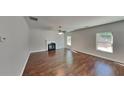 Bright living room featuring a fireplace, hardwood floors, and large windows at 1280 Sw Vonda Ln, Mableton, GA 30126