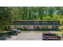Full exterior view of a charming multi-Gathering home with ample parking at 305 Stonecliff Ct, Stone Mountain, GA 30083