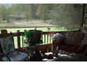Comfortable outdoor seating area with wicker furniture and floral cushions, perfect for relaxing and enjoying the view at 31 Dogwood Nw Ln, Cartersville, GA 30121