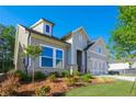 Stylish home with a manicured lawn, showcasing an inviting exterior at 2013 Ripple Park Bnd, Canton, GA 30114