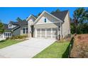Attractive home with a well-maintained lawn and an attached two-car garage at 2013 Ripple Park Bnd, Canton, GA 30114
