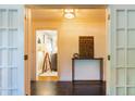 Elegant entryway featuring marble floors and a view into a bright living space at 400 Collier Rd, Atlanta, GA 30309