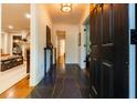 Inviting entryway with dark marble floors and views into the home's living spaces at 400 Collier Rd, Atlanta, GA 30309
