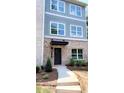 Charming two-story home with brick and siding, and manicured front yard at 5443 Blossomwood Sw Trl, Mableton, GA 30126