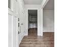 Inviting entryway boasts stylish wood flooring, with a glimpse into the home's well-lit interior at 851 Rockbridge Sw Rd, Lilburn, GA 30047