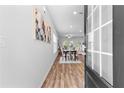 Inviting entryway with hardwood floors, leading to a dining area and living space at 1385 Vayda Ct, Marietta, GA 30066
