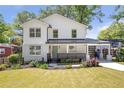Beautifully renovated two-story home with a well-manicured lawn and a welcoming front entrance at 1934 Westwood Sw Ave, Atlanta, GA 30310