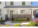 Welcoming front porch with stylish railings and meticulously landscaped garden, beautiful entrance at 1934 Westwood Sw Ave, Atlanta, GA 30310