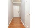 Hallway with hardwood floors and a white door at 3513 Brycewood Dr, Decatur, GA 30034