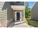 Stylish front entrance with stone accents and a dark-colored front door at 224 Eva Way, Cartersville, GA 30121