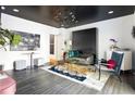 Unique bonus room with black ceiling, modern lighting, and stylish furniture at 1984 Yellow Finch Se Trl, Atlanta, GA 30316