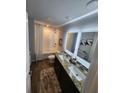 Modern bathroom with dual sinks, granite countertops, and a shower-tub combination at 4835 Station Lane -Lot 27, Union City, GA 30349