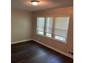 Bedroom showcasing new vinyl floors and bright window at 624 Moselle Sw Dr, Mableton, GA 30126