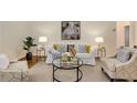 Cozy living room featuring stylish furnishings, neutral tones, and ample natural light at 1460 Briarcliff Ne Rd, Atlanta, GA 30306