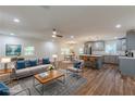 Open-concept living area featuring modern gray tones, hardwood flooring, and contemporary furnishings at 214 Adeline Nw Ave, Atlanta, GA 30314
