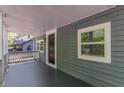 Covered porch with a view of the home's exterior, showcasing the entrance and a window at 214 Adeline Nw Ave, Atlanta, GA 30314