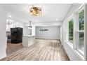 Bright and spacious living room features lots of windows and hardwood floors, adjacent to a modern kitchen at 2554 Gordon Se Cir, Smyrna, GA 30080