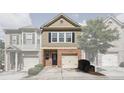 Charming townhome with a brick facade, attached garage, and well-maintained landscaping at 3203 Cyrus Point Nw Ln, Kennesaw, GA 30152