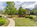 Beautiful townhome with a well-maintained lawn and lush landscaping surrounding the property at 4236 Tacoma Trce, Suwanee, GA 30024