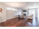 Spacious living room with hardwood floors, a fireplace, and natural light at 4236 Tacoma Trce, Suwanee, GA 30024