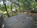 Spacious back deck is perfect for outdoor entertaining, with a wooded view at 981 Dundee Dr, Lilburn, GA 30047