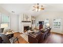 Inviting living room featuring a fireplace, vaulted ceilings and lots of natural light at 142 Jaime Dr, Canton, GA 30114