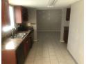 Kitchen featuring sleek black appliances, tiled floors, and a granite countertop at 432 Rock Meadow Dr, Stone Mountain, GA 30088