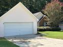 Close up of home featuring an attached two car garage at 159 Parkside Dr, Stockbridge, GA 30281