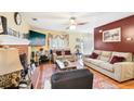 Cozy living room featuring hardwood floors, fireplace, and comfortable seating at 179 Parkside Dr, Stockbridge, GA 30281