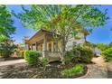 Charming home exterior featuring a cozy front porch and lush green landscaping at 3278 Shakerley Park, Douglasville, GA 30135