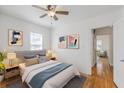 Comfortable bedroom with modern decor, hardwood floors, and soft natural light at 1560 Temple Ave, College Park, GA 30337