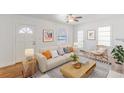 Bright living room features neutral tones, hardwood floors, and comfortable seating at 1560 Temple Ave, College Park, GA 30337