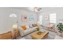 Bright living room featuring neutral decor, modern furnishings, and ample natural light at 1560 Temple Ave, College Park, GA 30337