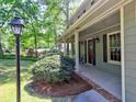 Charming front porch of the home, featuring a quaint seating area and manicured landscaping at 351 Ridgewater Dr, Marietta, GA 30068