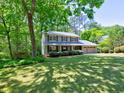 Two story home with a well-manicured lawn and mature trees, with a welcoming two car garage at 351 Ridgewater Dr, Marietta, GA 30068