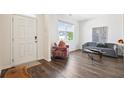 Bright living room features luxury vinyl plank flooring, modern furniture, and natural light at 1196 Erica Se Way, Atlanta, GA 30354